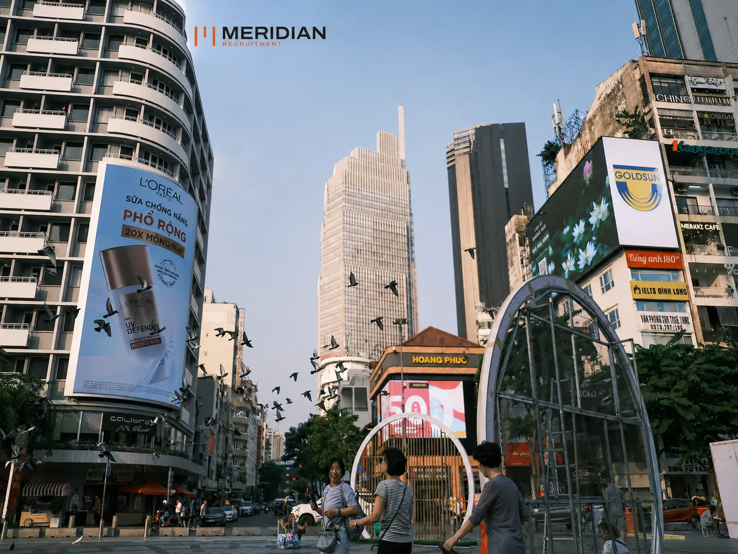 Outdoor advertising displays above a city street