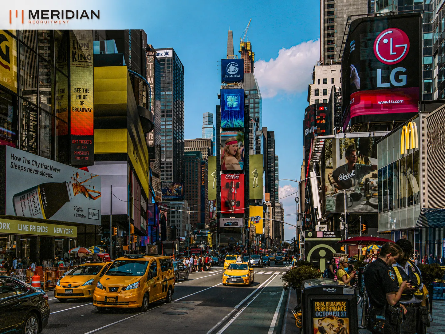 Digital billboards lining a busy city intersection