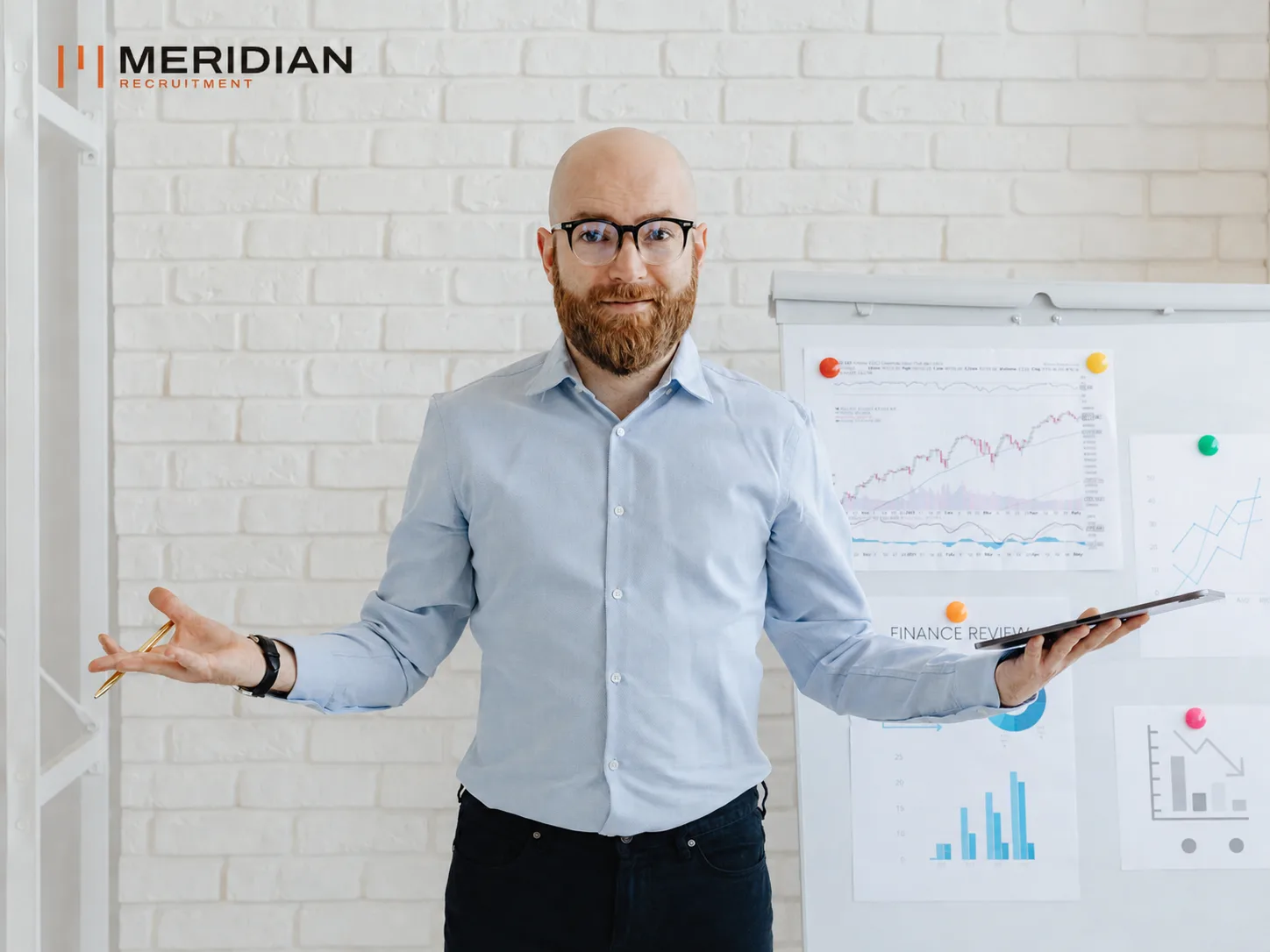 Consultant presenting compensation charts at a flip chart